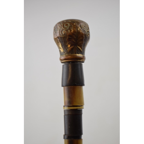 364 - Antique walking cane made of bone beads with brass top and ferrel. Length 84cm.