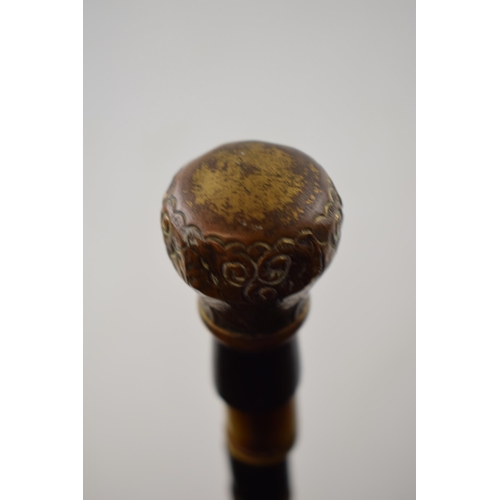 364 - Antique walking cane made of bone beads with brass top and ferrel. Length 84cm.