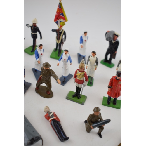 369 - A collection of Britains and similar lead military figures including soldiers, nurses and flag beare... 