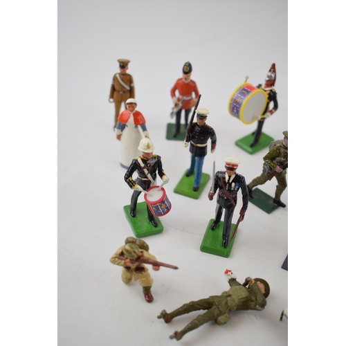 369 - A collection of Britains and similar lead military figures including soldiers, nurses and flag beare... 