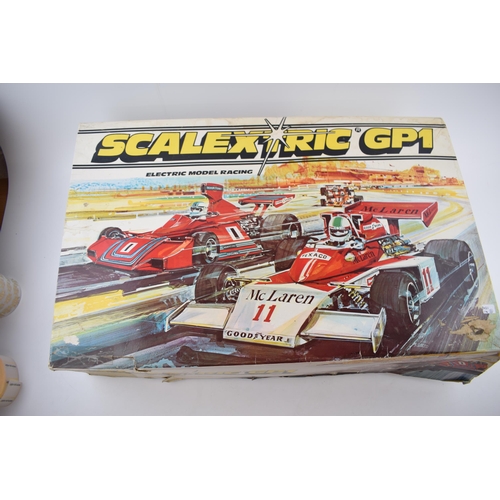 371 - Boxed Scalextric GP1 McLaren vintage toy racing set, both cars are present, one is missing rear spoi... 