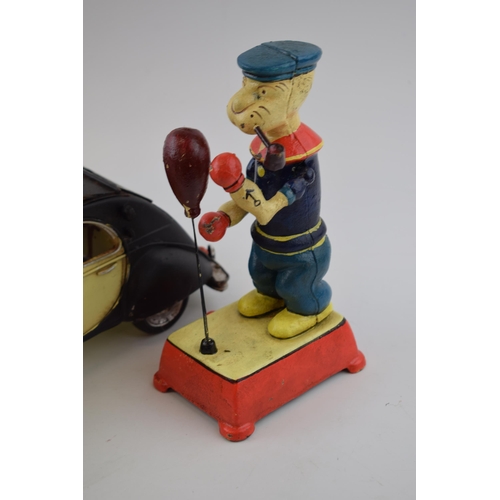 373 - Two vintage style Popeye boxing figures in cast metal (height 20cm) together with a tin Citroen 2CV.... 