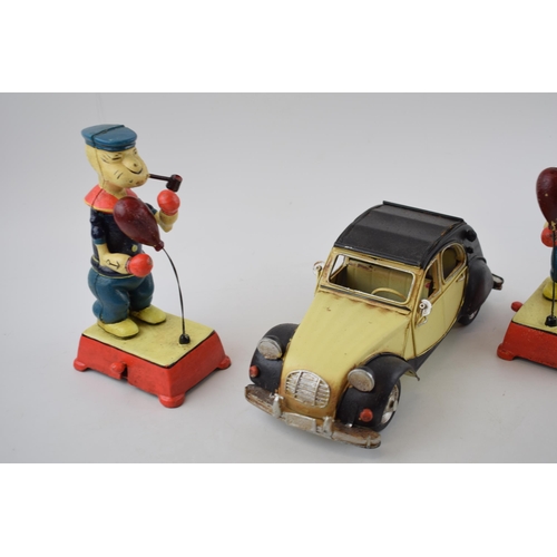 373 - Two vintage style Popeye boxing figures in cast metal (height 20cm) together with a tin Citroen 2CV.... 