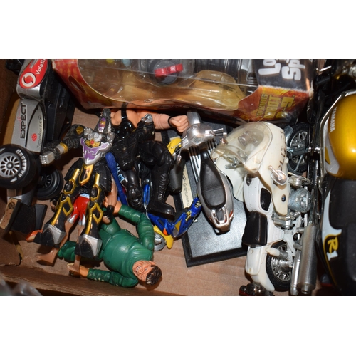 392 - A mixed collection of toys to include action figures and model motorbikes. (Qty)