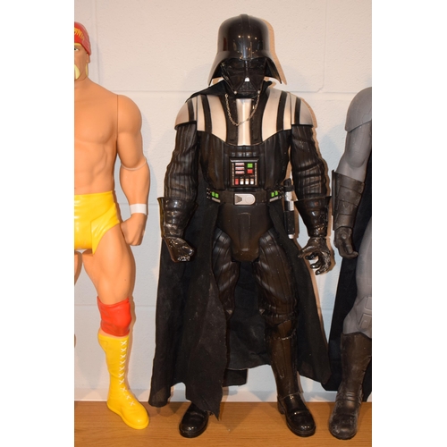 395 - A collection of action figures to include Hulk Hogan, Batman and Darth Vader. Height 82cm. (3)