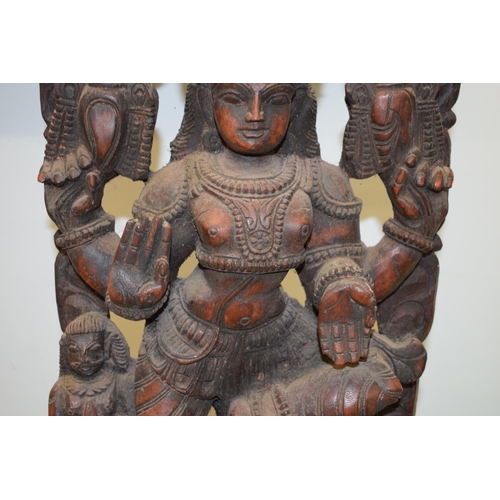 134 - A pottery wall hanging of a Hindu goddess, 62cm tall.