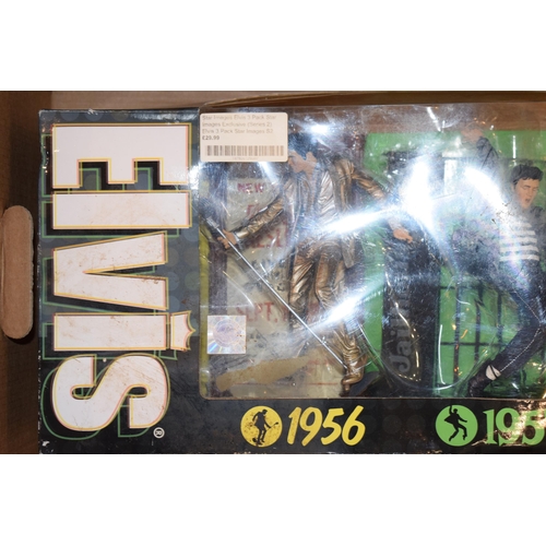 400 - Boxed Elvis Preseley figures, pack of three, 1956, 1957, 1961. Each figure approximately 17cm tall.