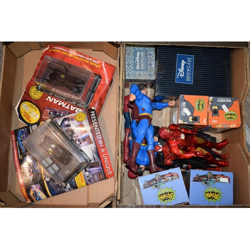 401 - A mixed collection of boxed Batman figures and two Batmobile cars together with Disney Showcase coll... 