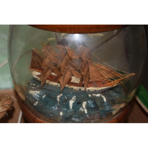 269A - Nautical themed items to include a resin model of the Titanic, a boat lamp base, a sailor figure and... 