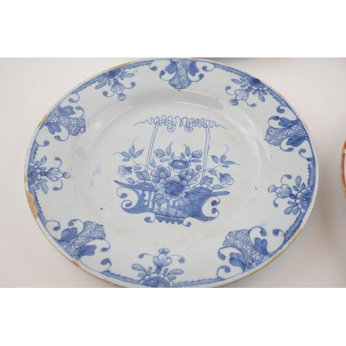 138 - A Delft tin glazed earthenware plate, mid 18th century, decorated with a central fence pattern with ... 