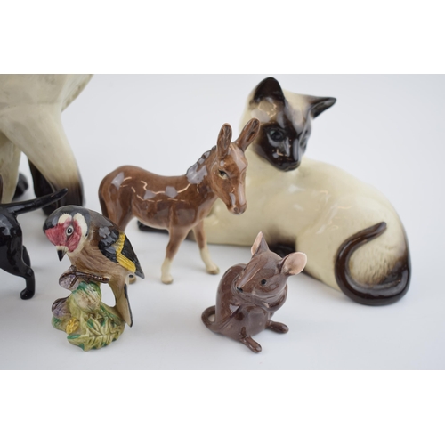 73 - Beswick animals to include a black labrador, a donkey foal, a mouse, a goldfinch and 2 siamese cats ... 