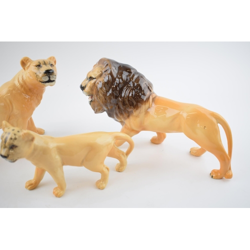 78 - A collection of Beswick Lions to include Lion 2089, Lioness facing left 1507 and Lion cub 1508 (3).