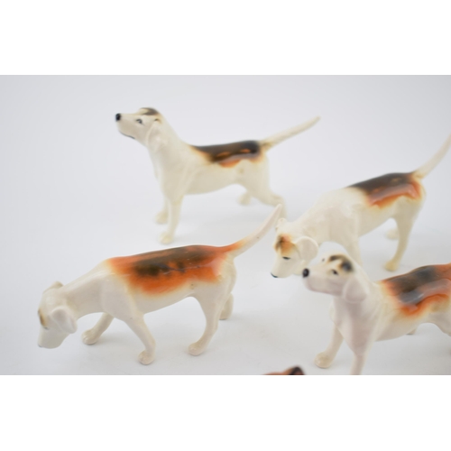 93 - A collection of Beswick to include 6 fox hounds and a fox (7).