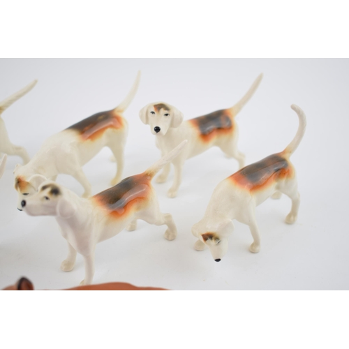 93 - A collection of Beswick to include 6 fox hounds and a fox (7).