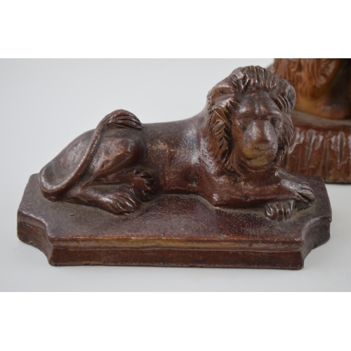 180A - A trio of 19th century salt glaze stoneware animals to include a lion, a spaniel and another lion, l... 