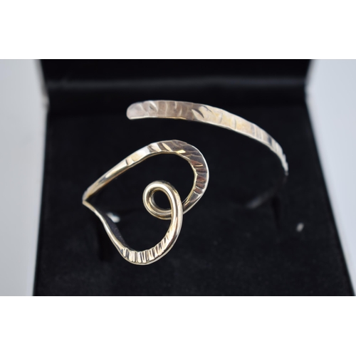 275 - Boxed Tianguis Jackson contemporary silver bangle in the form of a heart, fully hallmarked, 30.0 gra... 