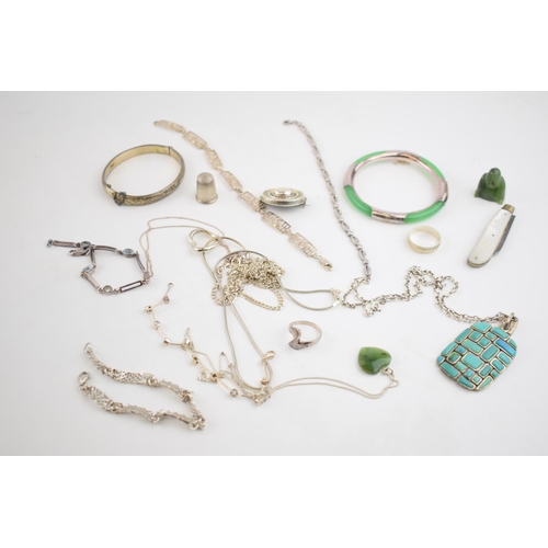 277 - A collection of silver jewellery to include necklaces, a heavy turqouise style pendant, a Jade (or s... 