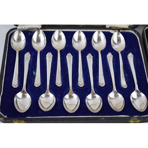 384 - Boxed silver teaspoons together with a set of cake forks with Art Deco style handles, fully hallmark... 