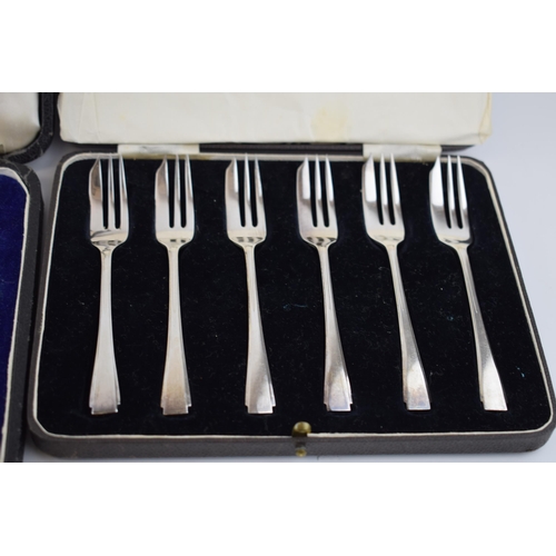 384 - Boxed silver teaspoons together with a set of cake forks with Art Deco style handles, fully hallmark... 