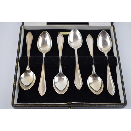 390 - A set of silver spoons hallmarked Sheffield 1945. In original retailers box, T.S Nedham & Murphy, Vi... 