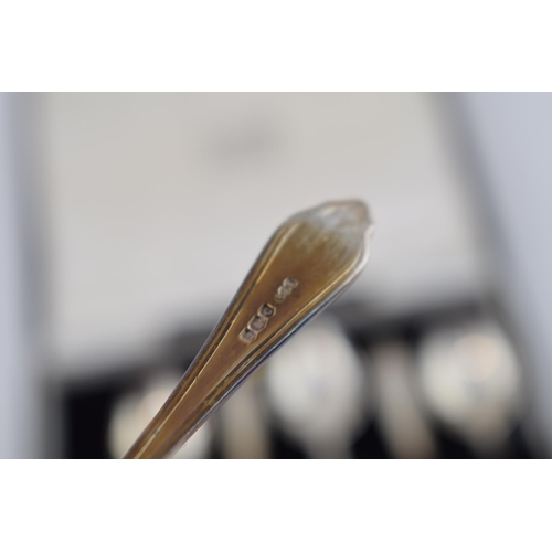 390 - A set of silver spoons hallmarked Sheffield 1945. In original retailers box, T.S Nedham & Murphy, Vi... 