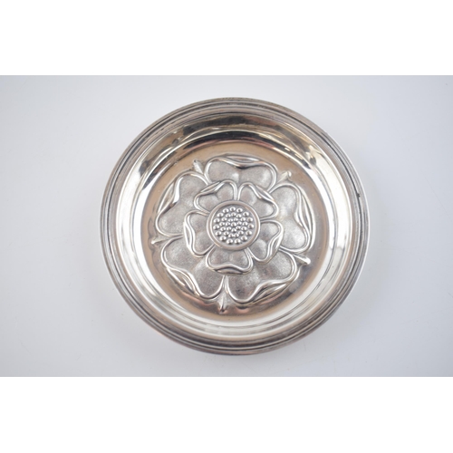 391 - Silver pin tray with repousse Tudor rose design to centre. Hallmarked London 1971. Diameter 9.5cm. 5... 