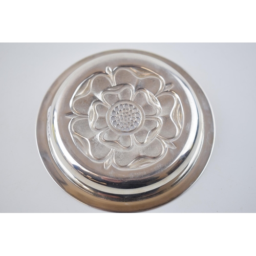 391 - Silver pin tray with repousse Tudor rose design to centre. Hallmarked London 1971. Diameter 9.5cm. 5... 