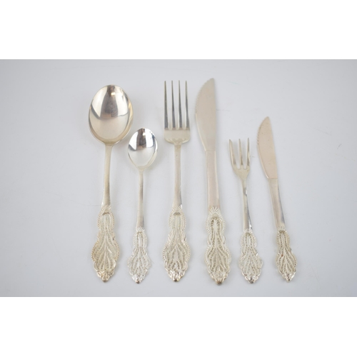 393 - A good collection of silver 830 cutlery with an ornate filigree design, hallmarked 830 with others, ... 