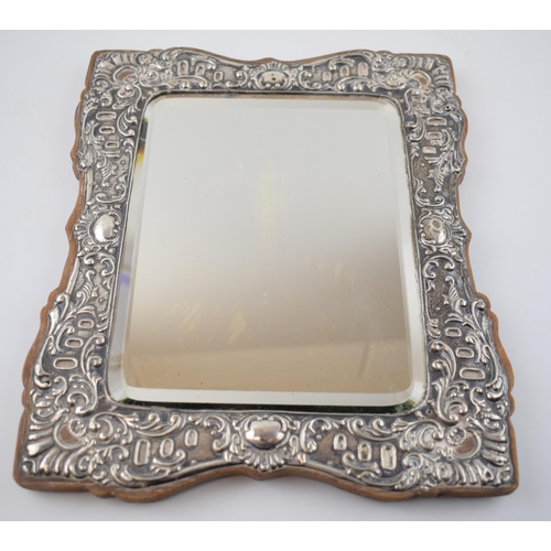 397 - Hallmarked silver framed rectangular mirror, on wooden back, Birmingham 1905, 28.5cm tall.