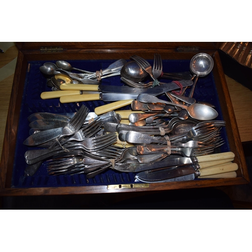 402 - A good example of a cutlery canteen in golden oak with inlaid brass shield to lid complete with a la... 