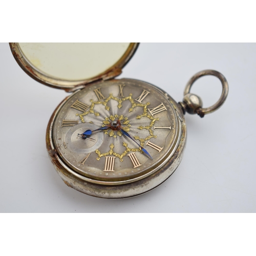 404 - 19th century silver pocket watch with blued hands and yellow coloured Roman numerals, 55mm wide (req... 