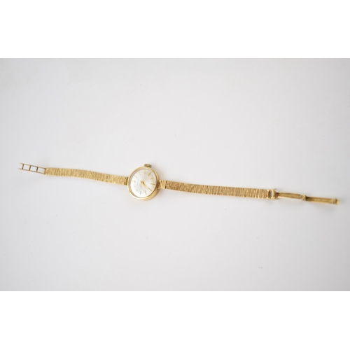 405 - 9ct gold ladies Garrard wristwatch on 9ct gold strap, cased, gross weight 15.9 grams, in working ord... 