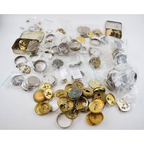 412 - A large quantity of pocket watch parts including movements, cases, crowns, and stems. Of note severa... 