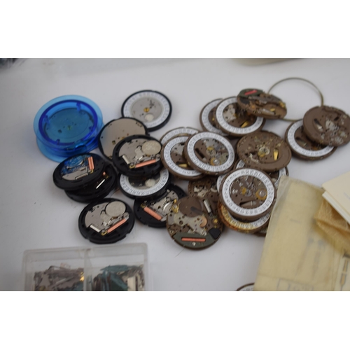 419 - A good collection of CWC military watch parts including over 50 movements, circuit boards, cases, lu... 