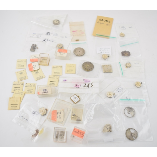 421 - A collection of Longines watch movements and parts. To include rotors, stems, with some NOS parts no... 