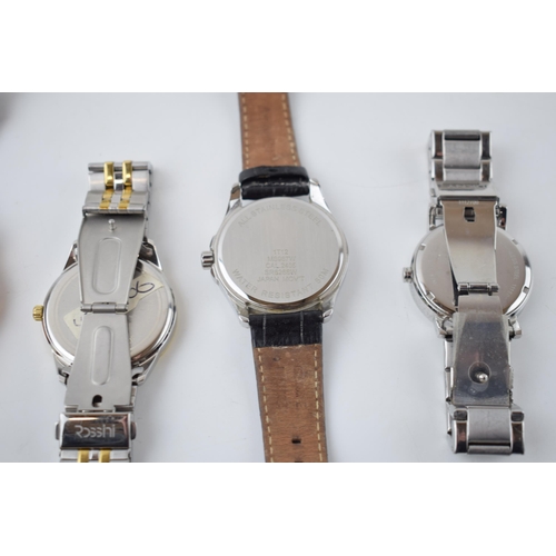 428 - A collection of gentleman’s fashion watches to include Armani, Rossini, DKNY, Accurist and Guess. (5... 