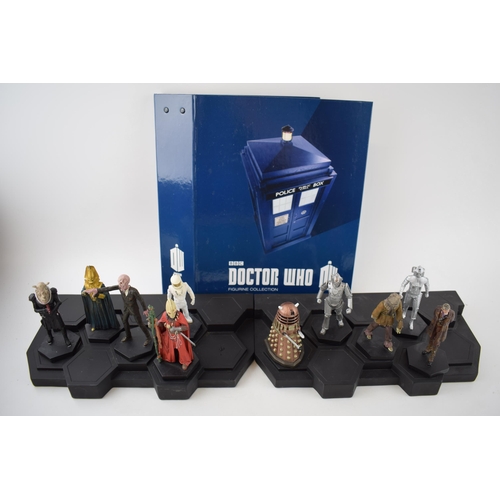 656 - A collection of Doctor Who figures by DW (TM BBC) together with display stand and accompanying magaz... 