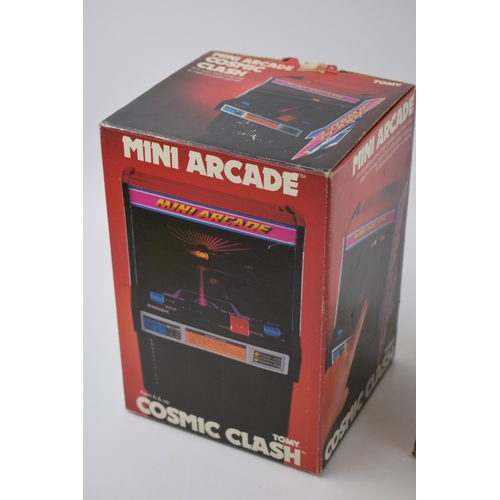 657 - Vintage boxed electronic games to include 'Tomy Cosmic Clash - Mini Arcade' together with 'U.F.O. In... 