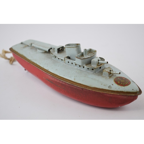 662 - Sutcliffe Models of a tinplate battleship 'Fury', 24cm long.