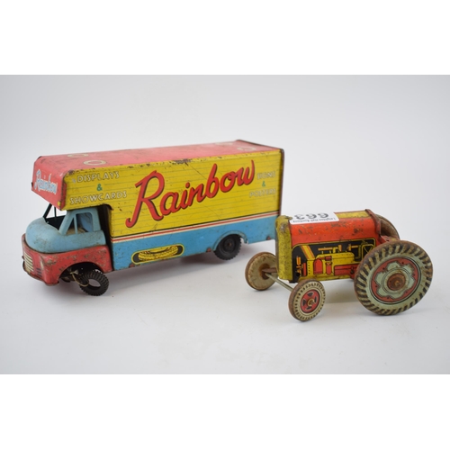 663 - Mettoy tinplate model of a tractor, with blue wheels and a red body, with a vintage tin plate 'Rainb... 