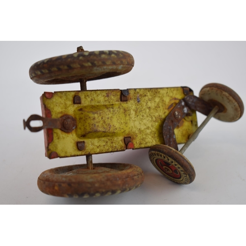 663 - Mettoy tinplate model of a tractor, with blue wheels and a red body, with a vintage tin plate 'Rainb... 