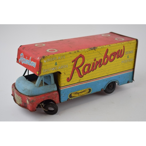 663 - Mettoy tinplate model of a tractor, with blue wheels and a red body, with a vintage tin plate 'Rainb... 