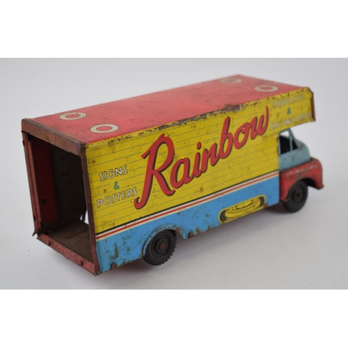 663 - Mettoy tinplate model of a tractor, with blue wheels and a red body, with a vintage tin plate 'Rainb... 