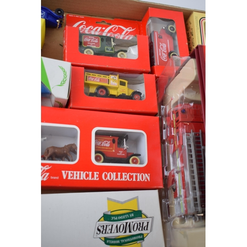 666 - A collection of boxed die cast model cars and trucks to include Coco Cola vehicle collection, Corgi ... 