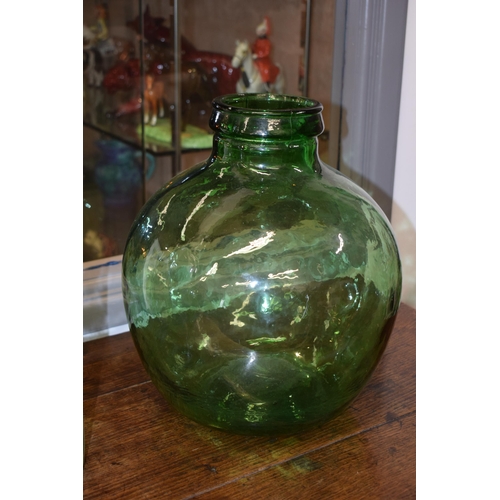 697 - A pair of large Viresa green glass carboys, 35cm tall, together with a Bells Scotch Whisky bottle (3... 