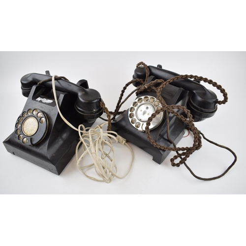 701 - A pair of vintage black Bakelite telephones with wires (2).