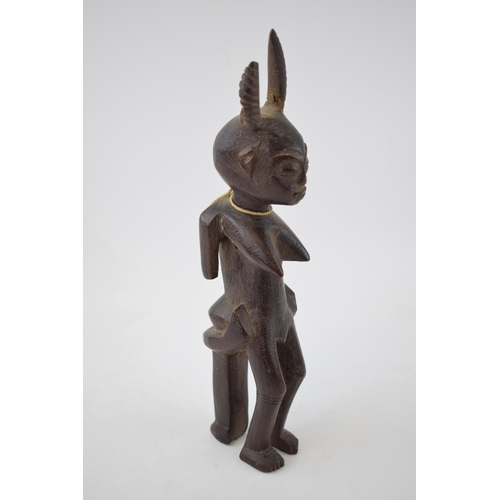 704 - Tribal 19th century wood carving sculpture possibly of West African decent. Height 33cm.