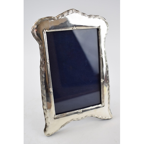 392 - Hallmarked silver photo frame with easel back, 20cm tall, London 2019.