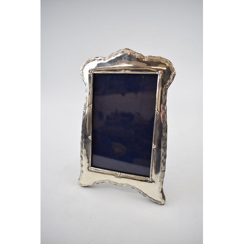 392 - Hallmarked silver photo frame with easel back, 20cm tall, London 2019.