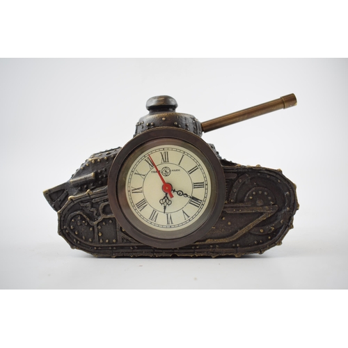 423 - Metal bronze effect mantle clock in the form of a mechanical tank, 16cm wide, working order.